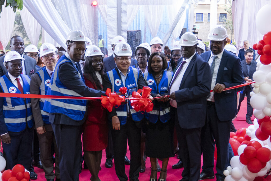 Cutting a ribbon to mark official launch of the factory